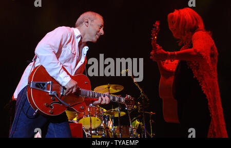 British singer/guitarist Mark Knopfler and American Emmylou Harris perform at Wembley Arena in London on June 8,2006. (UPI Photo/Rune Hellestad) Stock Photo