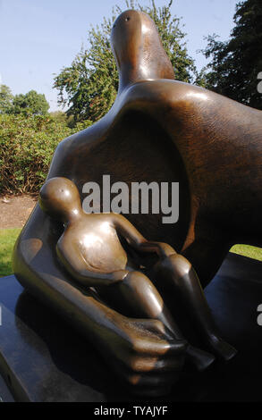 British sculptor Henry Moore's work 'Draped Reclining Mother And Baby' is displayed at a landmark exhibition in The Royal Botanical Gardens, Kew in London on September 13, 2007.  (UPI Photo/Rune Hellestad) Stock Photo
