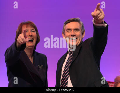 Britain's Prime Minister Gordon Brown and Deputy Leader laugh on stage during the final day of the 2009 Labour Party Conference in Brighton on Thursday October 01 2009.    UPI/Hugo Philpott. Stock Photo
