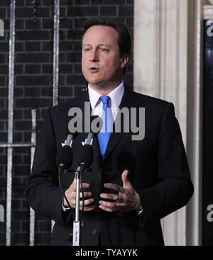 David Cameron speaks to the media outside No.10 Downing St after becoming Britain's Prime Minister following Gordon Brown's resignation this evening in London on May 10 2010.The Conservatives will be running the contry in a coalition government with the Liberal Democrats.   UPI/Hugo Philpott Stock Photo