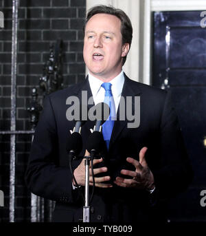 David Cameron speaks to the media outside No.10 Downing St after becoming Britain's Prime Minister following Gordon Brown's resignation this evening in London on May 10 2010.The Conservatives will be running the contry in a coalition government with the Liberal Democrats.   UPI/Hugo Philpott Stock Photo