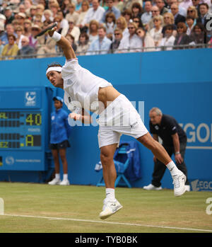 Spain's Feliciano Lopez serves during his Quarter-final match against Rafael Nadal at the Aegon championship in London.World No.1 Rafael Nadal lost the match 7-6,6-4.    UPI/Hugo Philpott Stock Photo