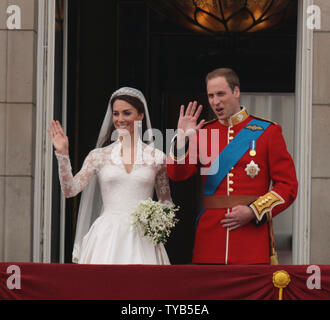 Prince William and Princess Catherine wave to the crowds on the balcony of Buckingham Palace after their wedding at Westminster Abbey on Friday April 29 2011 The Royal couple will now be known as the Duke and Duchess of Cambridge.    UPI/HugoPhilpott Stock Photo