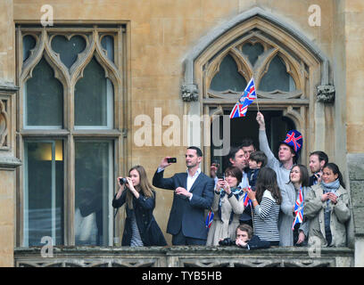 A crowd watches from a balcony as Kate Middleton arrives at Westminster Abbey for her wedding to Prince William in London on April 29, 2011. UPI/Kevin Dietsch Stock Photo