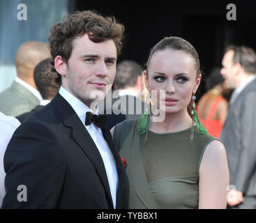 English actor Sam Claflin and his English actress girlfriend Laura Haddock attend the 'Arqiva British Academy Television Awards' at The Royal Festival Hall in London on May 27, 2012.     UPI/Paul Treadway Stock Photo