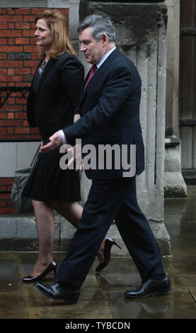 Former British Prime Minister Gordon Brown leaves the Royal Courts of Justice with his wife Sarah after being interviewed at the Leveson Inquiry in London on June 11, 2012. The Leveson Inquiry continues to investigate the ethics of the press with the present Prime Minister David Cameron facing Lord Leveson on Thursday this week.      UPI/Hugo Philpott Stock Photo