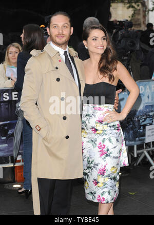 English actor Tom Hardy and his girlfriend Charlotte Riley attend the European premiere of 'The Dark Knight Rises' at The Odeon and Empire Cinemas Leicester Square in London on July 18, 2012.     UPI/Paul Treadway Stock Photo