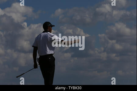 USA's Tiger Woods at the 8th green on the first day of the 2013 Open Championship in Muirfield, Scotland on July 18 , 2013.       UPI/Hugo Philpott Stock Photo