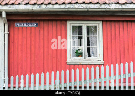 Norway color, view of a red clapboard house typical of 19th century Norwegian domestic architecture sited in the Norsk Folkemuseum in Bygdøy, Oslo. Stock Photo