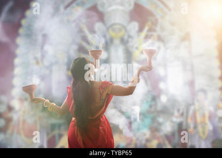 Bengali Women Performing Dhunuchi Dance On The Occasion Of Durga Puja Stock Photo