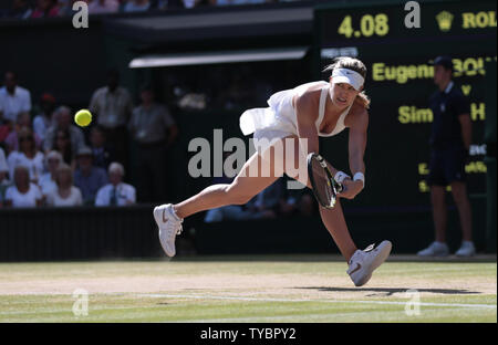 Canada's Eugenie Bouchard returns the ball in her match against Romania's Simona Halep on Ladies Semi-Finals day at the 2014 Wimbledon Championships in London on July 03, 2014. Bouchard won the match 7-6, 6-2.   UPI/Hugo Philpott Stock Photo