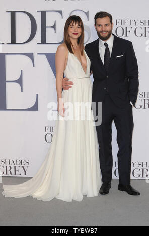 American fashion model and actress Dakota Johnson and Northern Irish actor and model Jamie Dornan attend the UK Premiere of 'Fifty Shades Of Grey' at Odeon Leicester Square in London on February 12, 2015.     UPI/Paul Treadway Stock Photo