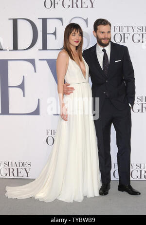 American fashion model and actress Dakota Johnson and Northern Irish actor and model Jamie Dornan attend the UK Premiere of 'Fifty Shades Of Grey' at Odeon Leicester Square in London on February 12, 2015.     UPI/Paul Treadway Stock Photo