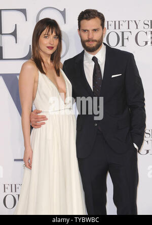 American fashion model and actress Dakota Johnson and Northern Irish actor and model Jamie Dornan attend the UK Premiere of 'Fifty Shades Of Grey' at Odeon Leicester Square in London on February 12, 2015.     UPI/Paul Treadway Stock Photo