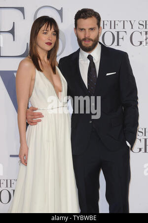 American fashion model and actress Dakota Johnson and Northern Irish actor and model Jamie Dornan attend the UK Premiere of 'Fifty Shades Of Grey' at Odeon Leicester Square in London on February 12, 2015.     UPI/Paul Treadway Stock Photo