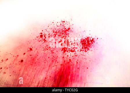 Red color explosion on white background Stock Photo