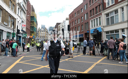 International Media report on the London terrorist attacks on June 4, 2017 in London. Last night three terrorists drove a van at pedestrians and committed a frenzied knife attack in nearby Borough Market. Seven people were killed and 48 injured. Police forensics officers continue to look for evidence in the area and large parts of London remain blocked off.      Photo by Hugo Philpott/UPI Stock Photo