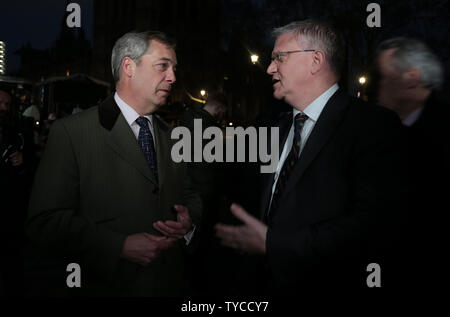 Former UKIP leader Nigel Farage speaks to Conservative MP Andrew Rosindell outside Houses of Parliament whilst the Members of Parliament prepare to vote on this evening's vital Brexit vote on January 15, 2019. Protests have increased lately as both sides of the Brexit debate have become more radicalized.        Photo by Hugo Philpott/UPI Stock Photo