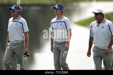 Team Europe's Ian Poulter, Justin Rose, and team captain Nick Faldo, from England, left to right, walk up the 18th fairway during the first round of the Ryder Cup at the Valhalla Golf Club in Louisville on September 19, 2008.  (UPI Photo/Mark Cowan) Stock Photo