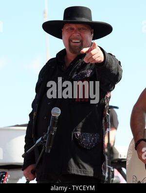 Eddie Montgomery of the country music duo Montgomery Gentry perfoms before the start of the NASCAR Sprint Cup Series Sylvania 300 at New Hampshire Motor Speedway in Loudon, New Hampshire on September 25, 2011.  UPI/Malcolm Hope Stock Photo