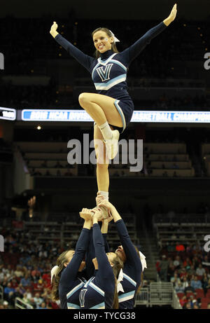 Villanova University cheer leaders cheer for their team against the University of Miami during the fourth round of the 2016 NCAA Division I Men's Basketball Regional Championship at the KFC Yum! Center in Louisville, Kentucky, March 24, 2016.         Photo by John Sommers II/UPI Stock Photo