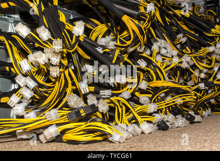 Stack of power cables from power supply unit Bitcoin Pc motherboard power cables and connectors Stock Photo
