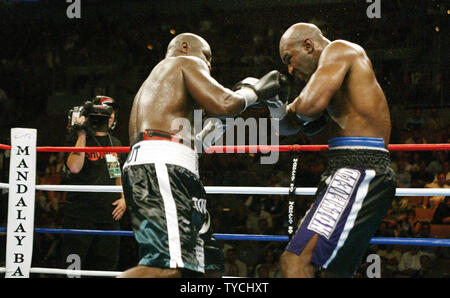 Cruiserweight champion James Toney (left) shows the punches he used throughout his fight with 4 time champion Evander Holyfield, causing the ex champion to miss and created the frustration that ultimately wound up in a 9th round TKO by Toney at Mandalay Bay, in Las Vegas, Nevada on October 4, 2003.  (UPI/ROGER WILLIAMS) Stock Photo