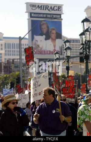 Protesters march along the Las Vegas strip where President George W. Bush spoke at a fund raiser at the Venetian Hotel in Las Vegas, NV on November 25, 2003. (UPI Photo/Roger Williams) Stock Photo