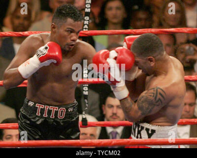Former multiple weight champion Tito Trinidad of Puerto Rico strikes back during a fight with undisputed Jr. Middleweight Champion of the World, Ronald 'Winky' Wright (R) of St. Petersburg FL. Wright easily won a 12 round decision in the fight where Trinidad barely won a single round, The fight was held at MGM Grand in Las Vegas, May 14, 2005.  (UPI Photo/Roger Williams) Stock Photo