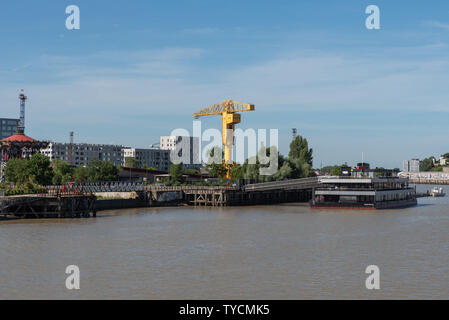 The Titan crane in the distance sits by the river Loire is a remnant of a rich industrial past, Nantes, Loire-Atlantique, France. Stock Photo