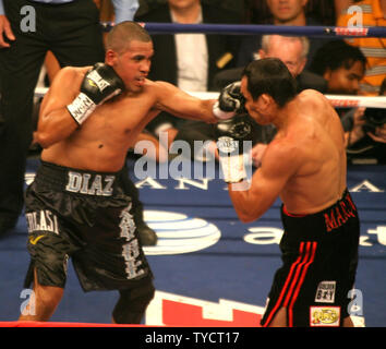 Juan Diaz of Houston (L) attacks Lightweight champion Juan Manuel Marquez of Mexico during their title fight at Mandalay Bay in Las Vegas Nevada, July 31, 2010. The fight was won by Marquez in a 12 round decision. UPI/Roger Williams. Stock Photo