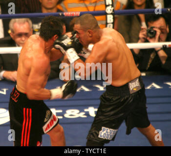 Juan Diaz of Houston (R) attacks Lightweight champion Juan Manuel Marquez of Mexico during their title fight at Mandalay Bay in Las Vegas Nevada, July 31, 2010. The fight was won by Marquez in a 12 round decision. UPI/Roger Williams. Stock Photo