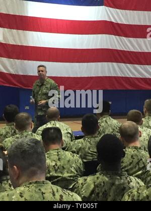 BAHRAIN (Nov. 01, 2016) Chief of Naval Personnel Vice Adm. Robert Burke speaks with Sailors during an all hands call discussing Sailor 2025 and rating modernization. Burke is  in Bahrain visiting Sailors assigned to the U.S. Navy's 5th Fleet of area of operation in the Middle East. Stock Photo