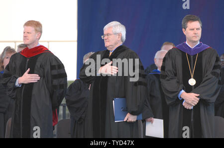 Liberty University Executive Vice President of Spiritual Affairs Pastor Jonathan Falwell (L), Former Speaker of the House Newt Gingrich (R-GA) (C), and Jerry Falwell, Jr., stand during the National Anthem at the commencement ceremony of Liberty University in Lynchburg, Virginia on May 19, 2007.  Falwell, Jr., has stepped up to Chancellor and President of Liberty University after his father Rev. Jerry Falwell died suddenly on May 15. (UPI Photo/Alexis C. Glenn) Stock Photo