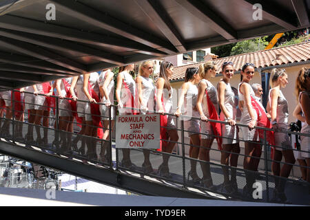 Hostesses line the exit of the pits at the end of the qualifying session of the Monaco Formula One Grand Prix in Monte Carlo on May 24, 2014. UPI/Maya Vidon-White Stock Photo