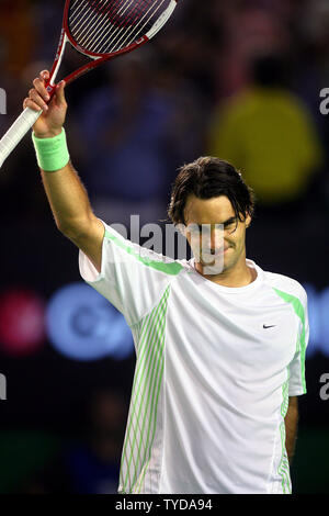 Roger Federer of Switzerland celebrates moments after