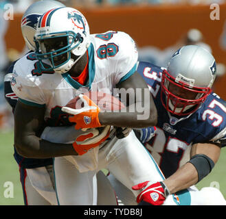 Miami Dolphins wide receiver Chris Chambers (84) against New England  Patriots saftey Rodney Harrison (37) in action at Pro Player stadium in  Miami, Fl. The New England Patriots beat the Miami Dolphins in overtime  19-13. October 19, 2003. (UPI/Susan