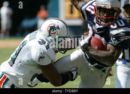 New England Patriots receiver Troy Brown stretches prior to game against  the Denver Broncos during the AFC divisional playoff game at Invesco Field  in Denver on January 14, 2006. (UPI Photo/Gary C.