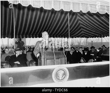 Photograph of President Truman delivering a speech that was broadcast around the world from the deck of the U.S. Coast Guard cutter Courier, which was used as a floating radio transmitter for the Voice of America. Stock Photo