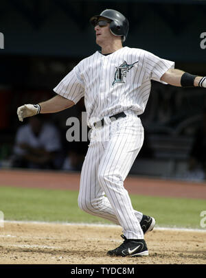 Former Miami Marlins player Jeff Conine waves to fans as he arrives for a  Miami Marlins baseball FanFest event, Saturday, Feb. 11, 2023, in Miami.  Conine is now a special assistant to