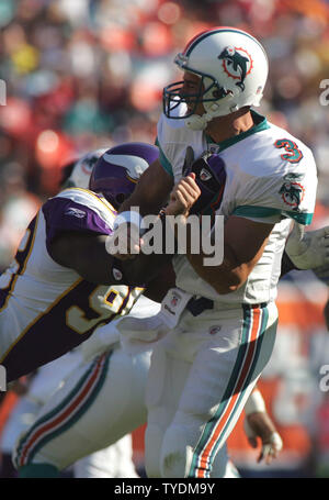 Miami Dolphins quarterback Joey Harrington (3) is pressured by Minnesota defensive end Kenechi Udeze (95) at Dolphins Stadium in Miami on November 19, 2006.   (UPI Photo/Susan Knowles) Stock Photo