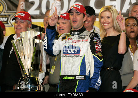 Jimmie Johnson and his wife Chandra celebrate with car owner Rick Hendrick winning the 2006 Nextel Cup championship at Homestead-Miami Speedway in Homestead, Florida on November 19, 2006. (UPI Photo/Michael Bush) Stock Photo