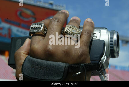 The hand of St. Louis Rams Roland Williams sports two Super Bowl rings as  he takes video at Media Day for Super Bowl XLI at Dolphins Stadium in Miami  on January 30