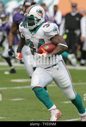 Miami Dolphins running back Ricky Williams checks play September 7