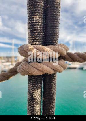 Clove Hitch Knot. It is knitted on shrouds of classic sailing ships for climbing the mast. Stock Photo
