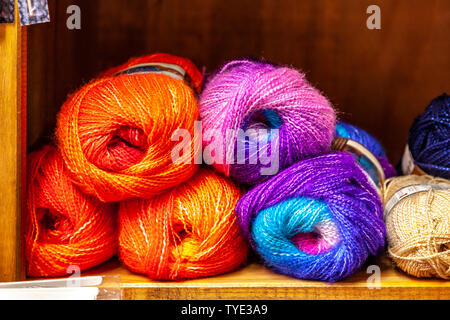 Display of different coloured knitting wools. Stock Photo