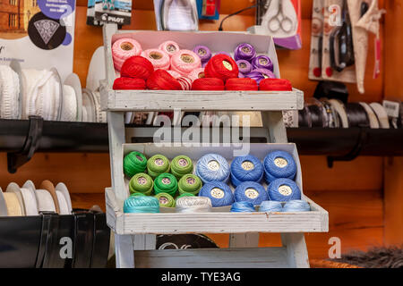 Display of different coloured needlework threads. Stock Photo