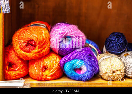 Display of different coloured knitting wools. Stock Photo