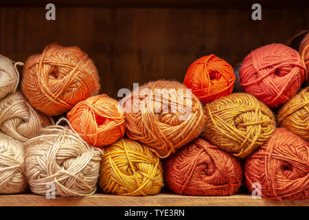 Display of different coloured knitting wools. Stock Photo