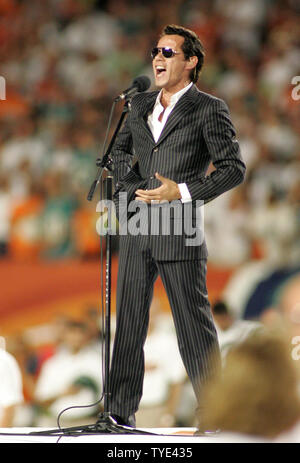 Latin recording artist and minority owner of the Miami Dolphins Marc Anthony performs the National Anthem prior to the game against the New York Jets at Landshark stadium in Miami on October 12, 2009.  The Dolphins defeated the Jets 31-27.  UPI/Michael Bush Stock Photo